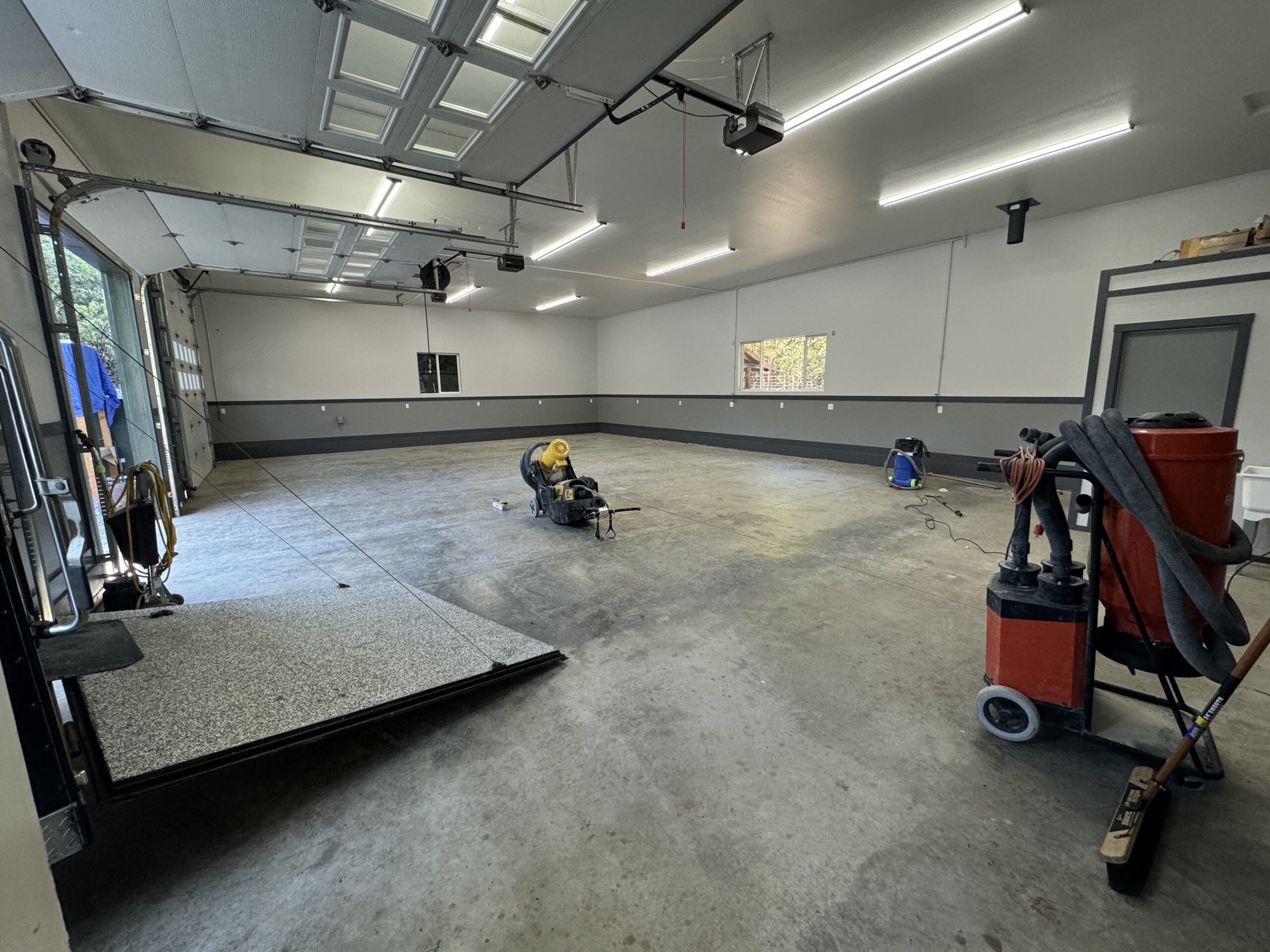 Garage floor preparation underway before a protective coating installation