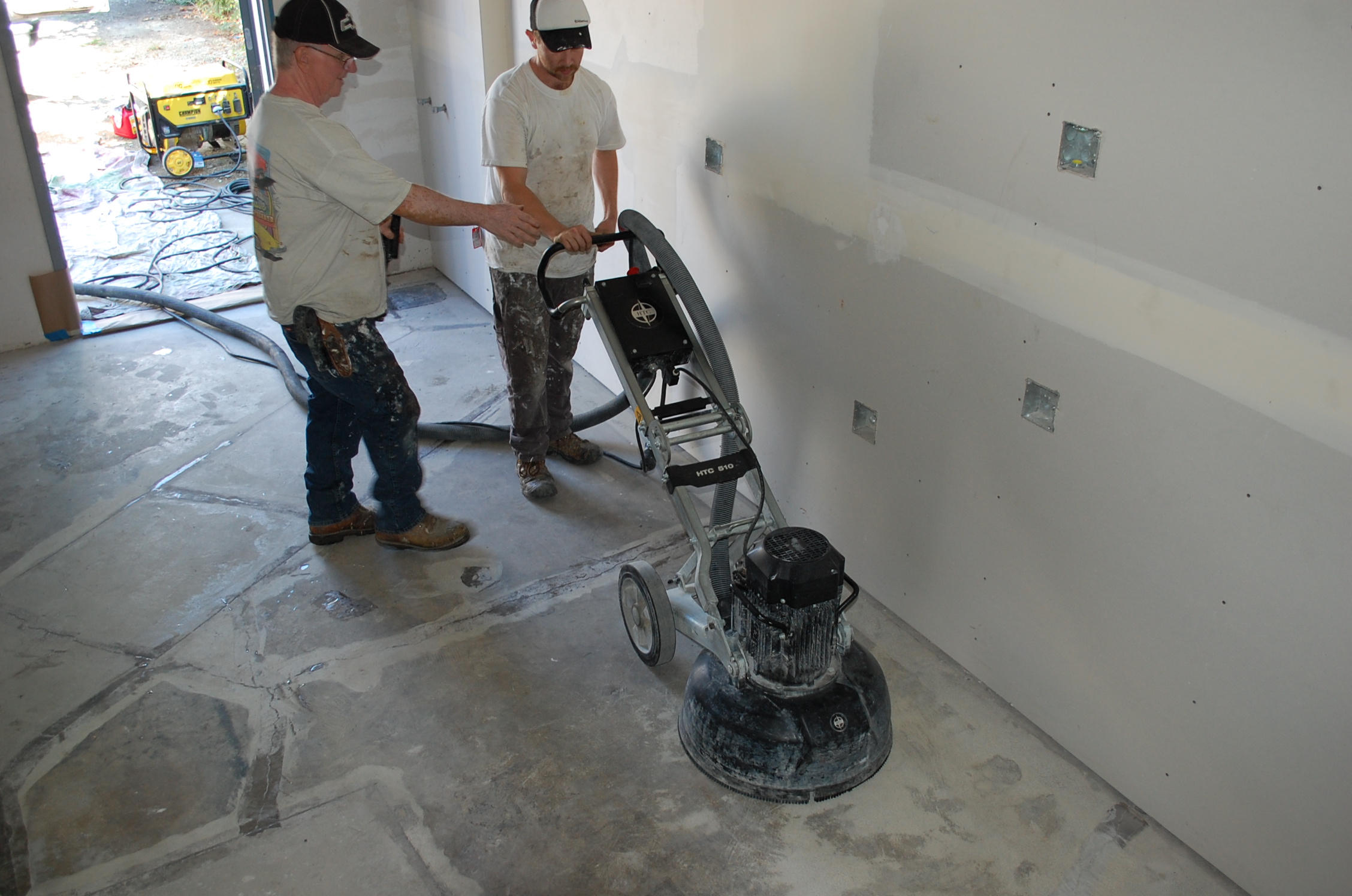 Stanley Coatings preparing a concrete floor before coating