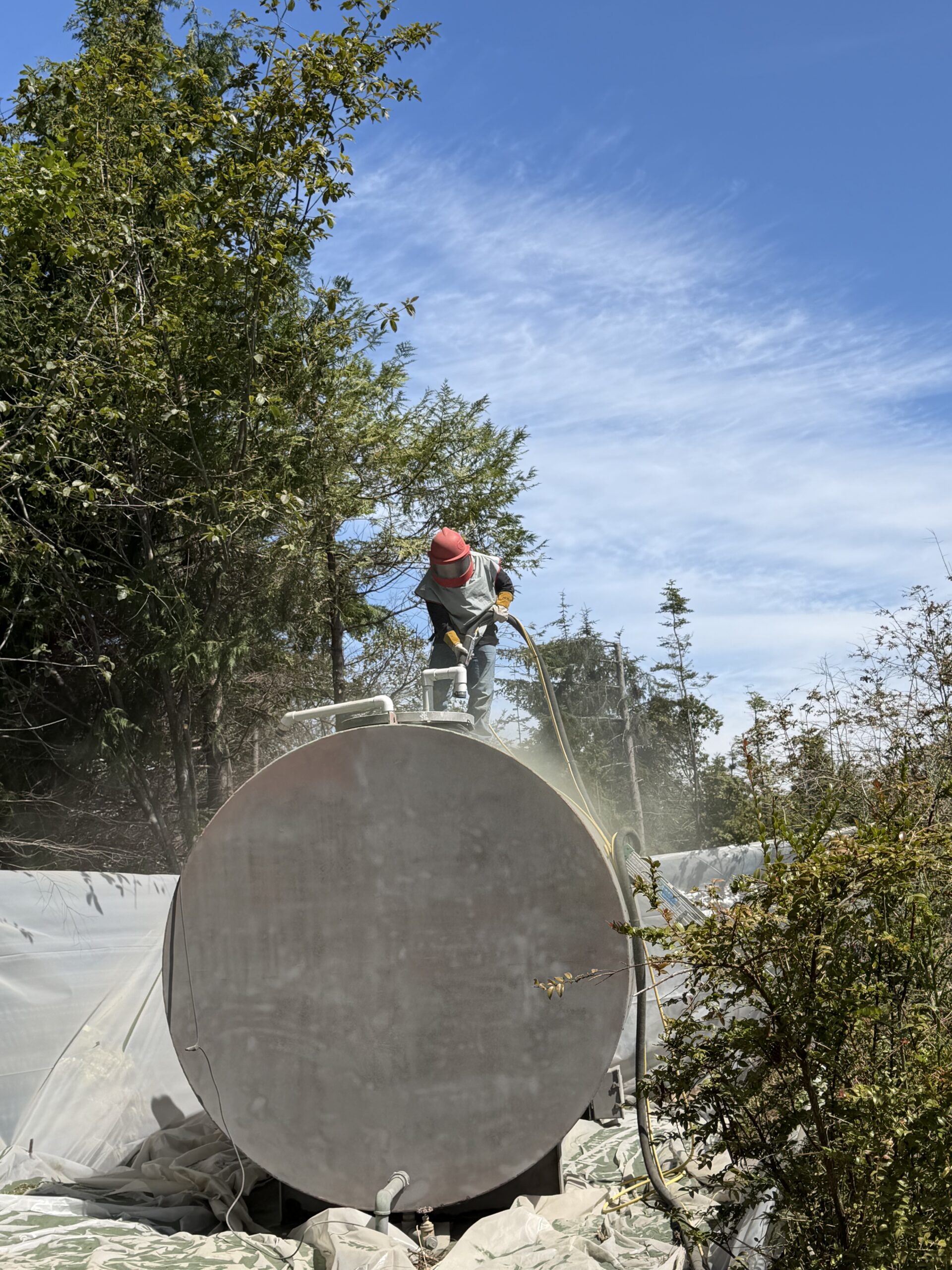 Industrial tank surface in an outdoor work area