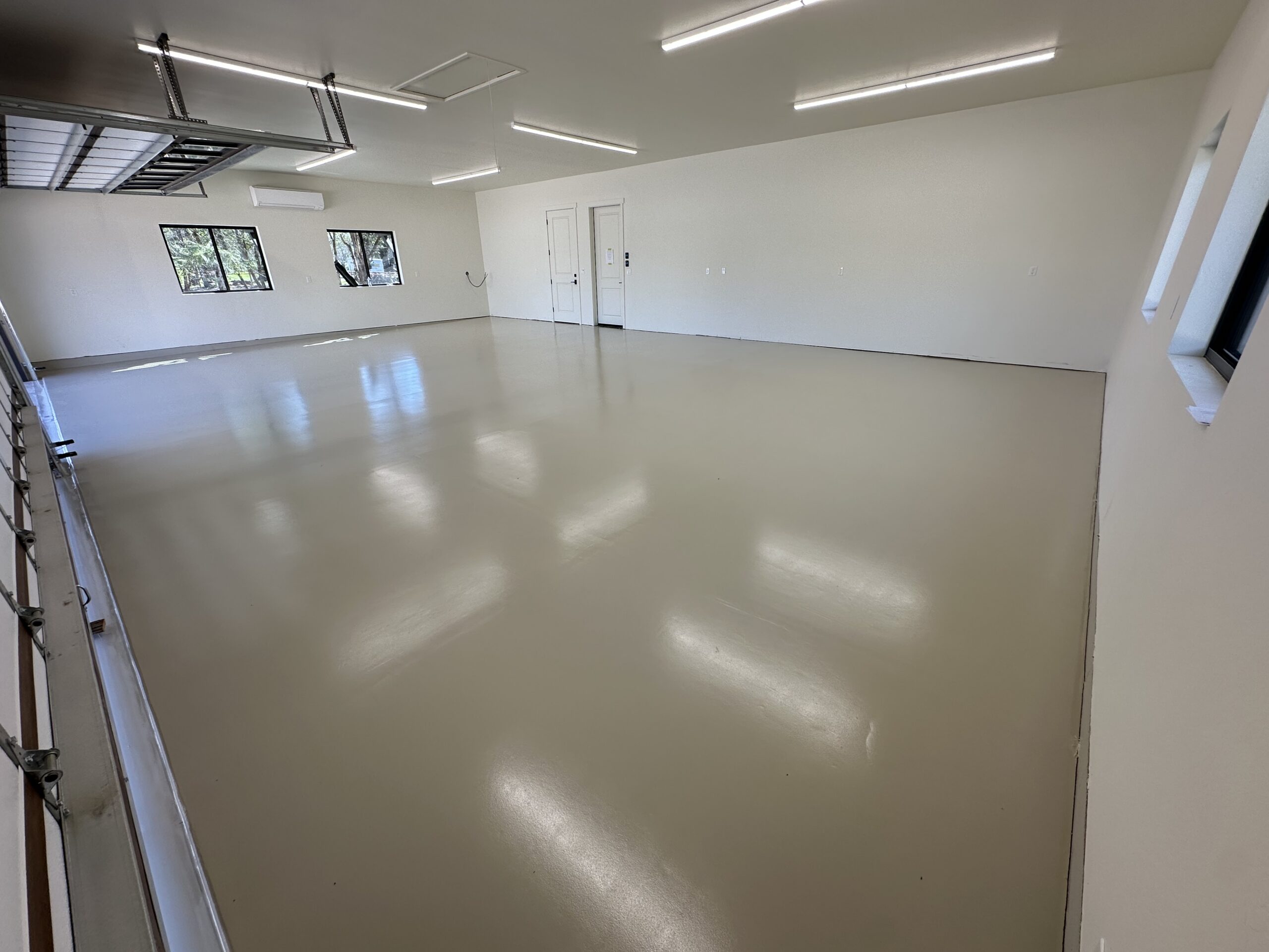 Finished seamless concrete coating in a spacious garage