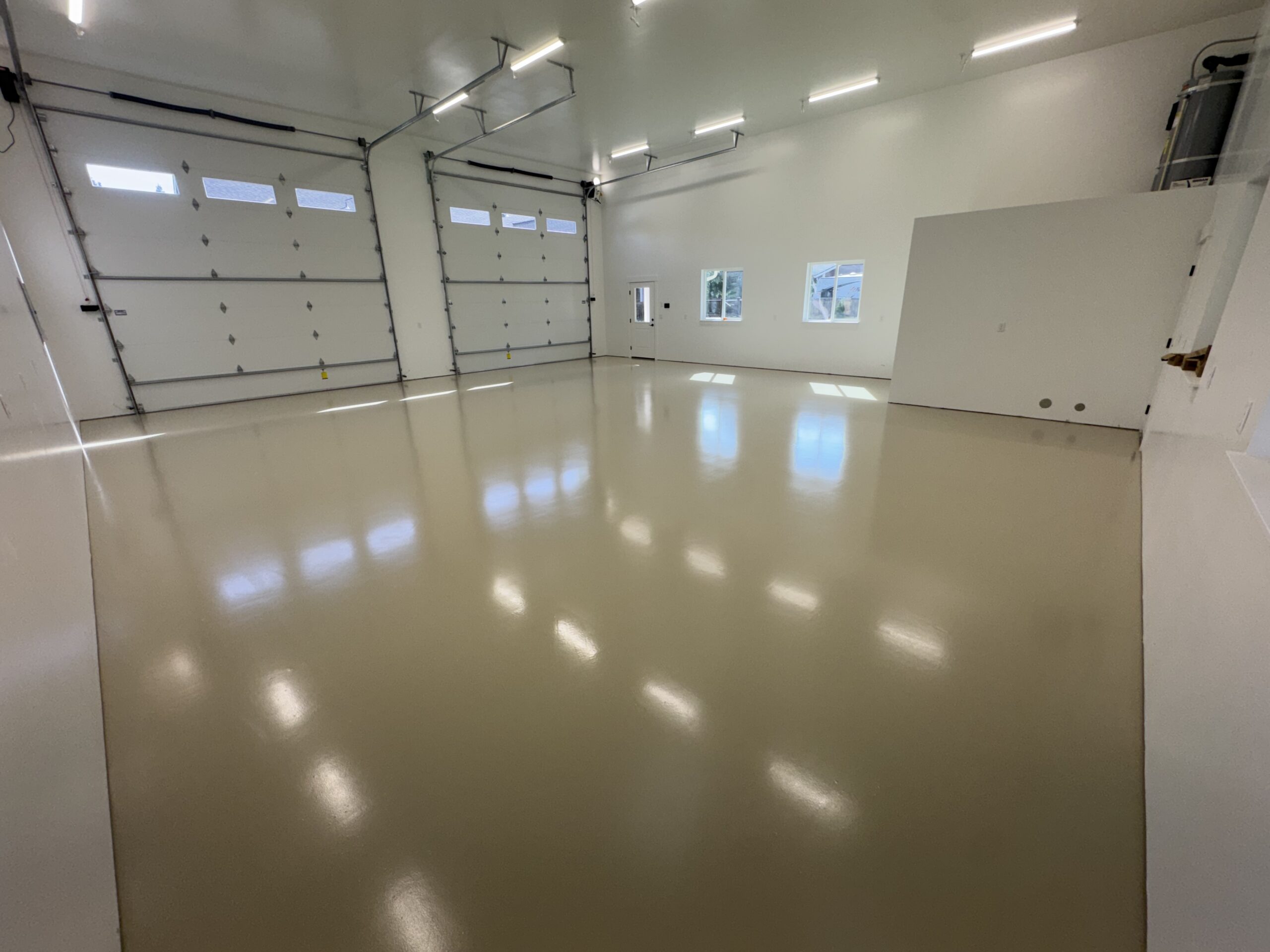 Smooth gray concrete coating in a spacious garage